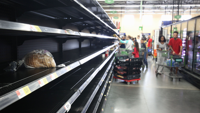 A loaf of bread is all that was left in the bread aisle of a Wal-Mart supermarket in Kissimmee, Florida as people buy supplies in preparation for the landfall of Hurricane Matthew, on October 6, 2016. Some three million people on the US southeast coast faced an urgent evacuation order Thursday as monstrous Hurricane Matthew — now blamed for more than 100 deaths in Haiti alone — bore down for a direct hit on Florida. (Image: Getty)